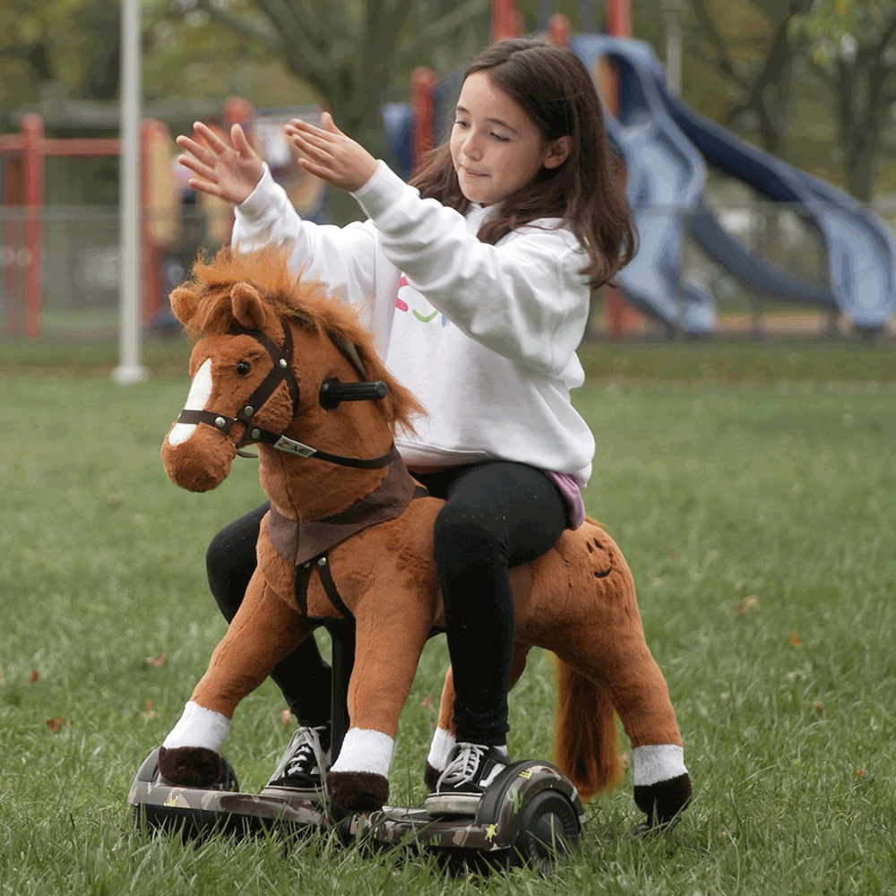 girl in white sweatshirt riding brown power pony