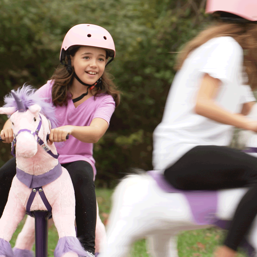 girl friends racing around on power ponies